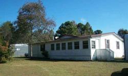 Secluded Mobile home on five acres with a pond. Private so you can hunt fish, play in your own backyard. Home has 4 beds, two bathrooms, enclosed porch, garage for 2 cars detached, also detached two car metal building workshop.Cindy Shaw is showing this 4