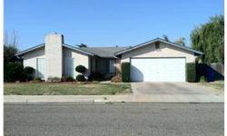 Swim at home in this nice 3 bedroom / 2 bath home in established neighborhood in Chowchilla. Home features an in ground pool, mature landscaping, cozy fireplace and wood stove, some exposed aggregate flooring.Listing originally posted at http