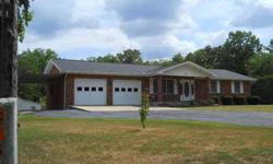 This beautiful all brick home is custom built and has so much to offer. Large open living room, dining room and kitchen. Three bedrooms, 2 baths and a large 2 car garage with a lot of extra space. Home has a beautiful big yard, covered front and back
