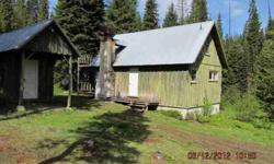 Nice cabin in he woods remote setting. Pond, creek.elk and deer,Sold as is no guarantees.10 acres appears to have water, and septic. up to buyer to dertmine status.cabin in good conditon wired for generator.Propane too.Owner carry @25%down, 10% and 3yr