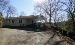 Cozy single-level home in Franklin NC! This home has a carport attached to the mudroom where you can walk your groceries into the home in any weather! Hardwood floors, thermal dual pane windows, Central Heat/AC. A very nice view, end of road privacy, and