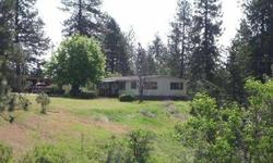6 1/2 Acres fantastic vies of Mt Spokane out front, views of valley and city lights out rear. Live in mobile or build your dream home. Priced to sell "as is", home is 1980 good condition, fireplace, family room and living room. SHOWN BY APPOINTMENT ONLY!