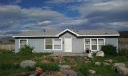 Great price on a 3 bedroom, 2 bath, manufactured home on a poured concrete foundation. One acre lot with 32x36 shop with 14 foot door. Wood stove and propane GFA heat.Listing originally posted at http