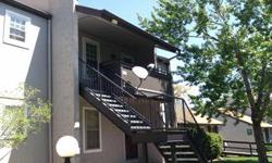 Great penthouse unit! Updated with double pane windows and tile flooring, fireplace, carport, large 2 bedroom with 2 baths. Quiet location! Nice condition! Must see for this price. Newer furnace and central air!Listing originally posted at http