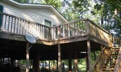 3/BR, 2BA. Central heat and air. Custom built wrap-around porch. Concrete foundation. Pier w/ boardwalk. Private boat ramp. Includes all furniture (beds/mattresses, couch, recliners, dressers, entertainment centers, fridge, stove, washer/dryer, assorted