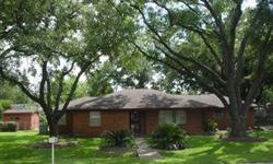 This cute brick home is loaded with charm. It is situated on a large corner lot (slightly under 1/3 acre) with majestic trees, covered back patio and gardens galore! Spacious bedrooms with beautiful hardwood floors. Formal living & dining. Refrigerator,