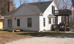 Omer is the smallest City in Michigan This house has three bedrooms with a walk out deck from the second floor bedroom. One bathroom and beautiful oak wood floors throughout the house. The river is 300 feet from the road. The lot size is 100 feet at the