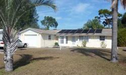 A cozy single story pool home by the sea. 2 bedroom 2 bath 1200 sq ft. It has a split bedroom plan, open living & dining area with a tiled fireplace. The pool has been restored to perfect condition and a screen enclosure has been added to keep mosquitoes