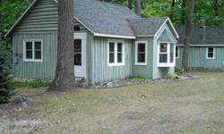 Adorable 2 log cabins on a double lot. Includes 119 & 115 Ray St. Both have 1 bedroom & 1 bath. Both cottages have new windows, doors and roofs. Back one completely redone. Within steps of Higgins Lake. Comes with a Sea Nymph boat. 2 cabins, 3 lots - 1