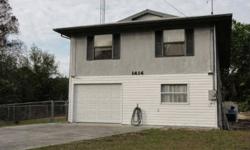 This 2 bedroom 1-1/2 bath waterfront home is an excellent winter home or weekend getaway. It is a stilt home that has an elevator to get to the main living area. Under the home is a garage with room to expand to a larger garage or workshop area. The hal f