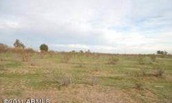 1ac parcel in Wittmann with water and power, flat, no flood, no flight zone. OWNER WILL CARRY with little down. 5, 1ac parcels to choose from. Buy one - Buy all five for even a better deal. Newer custom homes all around. Close to the US 60. Great