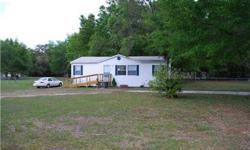 A MUST SEE, country living with space to enjoy, this beautiful property is 1.58 acres with lots of mature oak trees, and close to everything. A newer 3 bedroom 2 bath mobile home, spacious floor plan, with all appliances included, situation with a