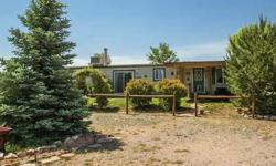 Beautiful one acre horse property with many trees, including Austrian Pine, Blue Spruce and shade trees. There is even a Kentucky bluegrass and fescue lawn plus lots of colorful flowers. Hang out and watch the beautiful Arizona sunsets from the covered