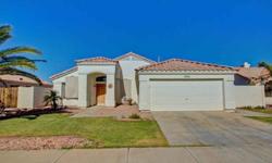 Wow! What a great home! Walk into a dining/living room combination. Tile and laminate flooring. Ceiling fans and decorator paint throughout. The floorplan has great flow - features large family room with fireplace. Spacious kitchen with breakfast bar,