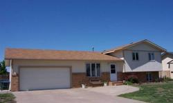 This updated split level has ceramic tile in the kitchen and dining. There is a bath with ceramic tile off the master bedroom and two more bedrooms and a full bath on the upper level. The lower level family room has a wood burning stove. There is a two