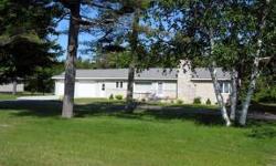 Ranch style home overlooking Lake Michigan and the Manistique Lighthouse. This home features an updated marble tile, gas fireplace, updated bath and a half, 3 bedrooms, sun room, spacious kitchen and dining area, 2 stall attached garage and partially