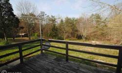8 acres of peace and quiet in beautiful Middletown VA. Enjoy mature trees, wildlife and more. This home features a living/dining room with brick fireplace, kitchen, spacious bedroom and finished walkout basement. Fantastic investment opportunity!Seller