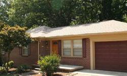 This one level brick home in the city features a large fenced back yard with wooded privacy and rear deck. The home offers an updated kitchen, hardwood floors, remodeled bath, and separate laundry room. There is a floored and lighted attic. The roof is