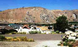 Large Lake Entiat Estates parcel with a defined driveway and level building site, nestled between two very nice homes located on the upper portion of Lake Entiat Estates along Entiat Place. Lot 14 is almost a 1/3 of an acre with excellent views and easy