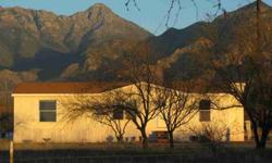 Rural living, just under 5 acre parcel boardering State Land. Zoned for Horses, this 1482 SF Man Home waiting for a new owner. Great Views of the Santa Rita's and Elephant head. Located at the end of the road, lot's of possibilities.
Listing originally