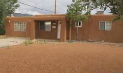 Cute southwestern style home in quiet neighborhood. Recently remodeled. Upgrades include thermal pane windows, kitchen cabinets with glass fronts, new laminate floors in living areas, Italian tile floors in kitchen & updated baths. Walls have been