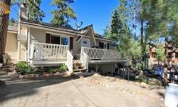 Queit and secluded feeling in this Sierra style cabin nestled amongst the trees. Pride of ownership throughout this 2 bed, 1 bath home. Formal dining room, w/d hookups, forced air heating, dual pane windows, and a beautiful stone fireplace. Huge lot for