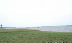 Breathtaking views of Pamlico River. Waterfront lot in Eagle Trace, bulkhead, C3 one of the largest outer boat slips in 52 slip marina with water and electric. Many amenities, clubhouse, secured storage, 1000 nature walk, tennis courts, boat launch, etc.