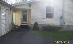 Excellent location close to village across from golf course. Split bedroom plan, sun room, mud room, porch, 21/2 detached garage, vinyl siding, black top drive, clean, well maintained, landscaped, moving priced low for quick sale. Call 315 804 4564 or315