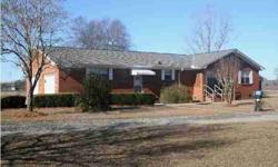 * PRICE REDUCED * Updated brick home on 7.15 acres on paved road for $125,000 or purchase home and 2.15 acres for $115,000. Home has exceptional features that include updated kitchen with smooth surface range, dishwasher, refrigerator, microwave and extra