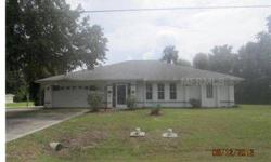 Ranch style house on over-sized corner lot. Three bedrooms/2 baths with combination living and dining rooms. Open kitchen with breakfast bar. Screened lanai with in ground pool. Two car attached garage. Property is a fixer upper. Sold as is with no proper