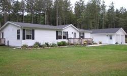 Well maintained 5 year old 1350 sq ft. manufactured home for sale. Located 8 miles East of Mauston on 5 wooded acres. The home has three bedrooms and two bathrooms. An open concept kitchen, dining, and living room area are at the center of this home.