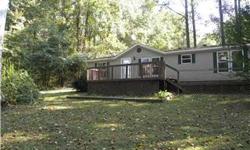 Price Reduced!!!! PERFECT SPOT IN THE WOODS. THREE BEDROOMS, 2 BATHS AND KITCHEN AND DINING WITH SEVERAL WINDOWS OVERLOOKING WOODS. LARGE FRONT AND SIDE DECKS TO COOK OUT AND ENTERTAIN. LARGE STORAGE SHED. LARGE SHADED YARD WITH LANDSCAPING. JUST A LITTLE