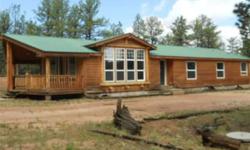 Fantastic manufactured home tucked in the trees with a covered front deck and open floor plan. The detached 2 car garage is a great addition to this already wonderful home.Make it a primary or secondary home.ITs close to fishing,hunting and wildlife. Hard