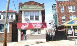Make an Offer! Motivated seller! This single brick building is a residential 2 bedroom apartment on the 2nd floor which is currently rented plus a commercial store front on 1st floor which is also currently rented out. Great rental investment on either