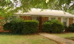 Spacious older home on corner lot in Country Club Estates. Storage room off carport has cabinets and wood floor. Large laundry with sink and cabinets. House needs updating but there is some hardwood under carpet.Sunroom off den is unheated. GasPac