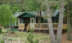 Adorable Knotty Pine Cabin on the Sugar Camp Chain. This sweet two bedroom, one bath year round home has 150 feet of frontage on the channel between Chain and Echo Lake of the Sugar Camp Chain. The pier overlooks the meandering quiet no-wake channel where