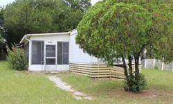 Great Price and Location for this 2 bedroom 1 bath single wide manufactured home in Lady Lake. This home has a screened porch with a nice view of the fenced yard. The location is close to The Villages, hospitals, shopping and wonderful restaurants.Listing