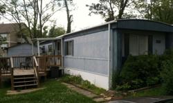 I am selling a 2BR, 1 large bathroom trailer currently located on a large lot in Independence Hills in Morgantown. The house is 12x60 and in very good condition. The house includes a newly built deck, two large outdoor storage sheds, new washer and dryer,