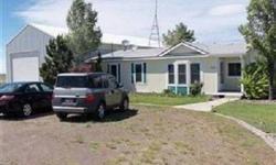 Nice 2 bdrm, 1 bath home. 2nd bath was made into an office. Easy to convert back to bathroom. Many updates. Sits on 6 acres, and has full sprinkling system, garden area and nice landscaping. 30x60 shop with power, 2 offices, and bathroom. RV parking and