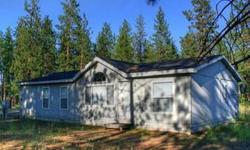 Secluded country property with modern living! Wild life and green surroundings invite you to this 3 bedroom, 2 bath, and open concept home on 5 acres backed by state land! Some of the wonderful amenities included are master suite, direct TV, Hughes net