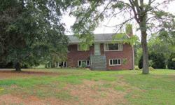 This nice brick home sits on 7 acres in the country. House has 3 bedrooms, 2 baths, living room with wood burning fireplace, dining room, and eat-in-kitchen. There is a full basement that could be finished which currently offers lots of storage space. The