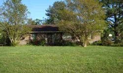 Fantastic brick rancher! Desirable location out of the City limits so only County taxes apply. Nice sized rooms with living room, den, kitchen, and dining room. Wood burning fireplace. Large two car garage. Sits on a great lot with fenced in backyard.