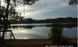 Well designed possible owner financing 3/2 lake home on 3 acres right on Higgenbotham Lake in east Hawthorne between Gainesville and Palatka and Ocala and Jax. This is a clearwater lake large enough for all water sports including skiing, tubing or