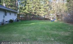 Extremely well kept 3 bedroom, 1.75 bath home in the heart of Lake George. Newer 30x40 garage, paved driveway, and additional sheds, lean to's for storage and a play house!Listing originally posted at http