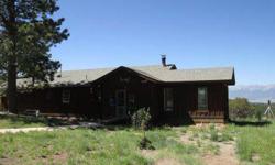 M&T6X-Have you ever just wanted to own a mining claim? Now you can own your own mining claim plus a great home to boot! Located in the old mining town of Rosita, this 3.64 acres offers some of the BEST VIEWS in the area and tall ponderosa pines surround