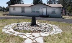 This wonderful home sits on nearly an acre with a front lawn water feature and a back porch pergola. Sprinkler system in the front lawn and impulse sprinkler found on the rest of the property. Asphalt driveway. Updates everywhere inside. Full sized pantry