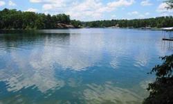 LEWIS SMITH LAKE - This beautiful lake lot is unrestricted. It lays very gentle to deep year round water. The shoreline is rocky and has 133 feet of shoreline. An old platform from a previous boat dock is along the shore. The roads are all paved to the