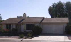 Great Ahwatukee home in a wonderful neighborhood near South Mountain. This house has a split master with slider opening to patio and two large closets. Second bedroom is spacious with ample closet space as well. The great room floorplan has a wood burning