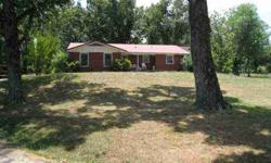 with a nice comfortable 3-BR/2-BA brick home that features a sunroom, large covered back deck and new metal roof. Very pretty country setting w/large shade trees, fenced garden w/orchard and plenty of established pasture for your livestock. PLUS, there is