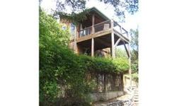WOW- lowest priced hs in sought after Comanche Trails area, view of Lake Travis, lot with 500sf hs next door also for sale, sweet hidden home, very private, fully furnished, move in to your lakehouse now! 4 decks to hang out on, hardwood floors, clawfoot